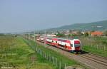 263 004-4 schiebt den Os 3023 von Bratislava hl.st. nach Leopoldov am morgen des 01.05.2013 bei Prezinok zast.