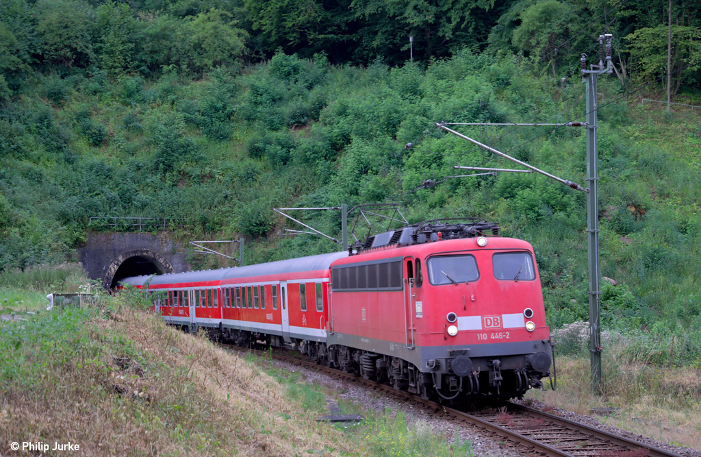 110 446-2 mit dem RE 19557  Enztäler Radexpress  von Bad Wildbad nach Stuttgart am 28.07.2013 bei Neuenbürg(Enz).
