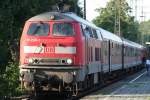 Die 218 206-1 zieht den RE12 von Kln Messe/Deutz nach Trier in Kln West am 15.08.2009