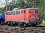 140 808-7 mit drei ihrer Schwestern im Zug, die wohl zur Verschrottung überführt wurden, aufgenommen in Gremberg am 28.07.2010