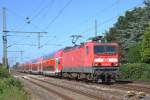 143 966-0 mit dem RE Kiel Hbf-Hamburg Hbf am 1.8.11 bei der Einfahrt in den Bahnhof Wrist