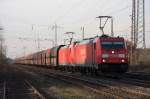 Dir Railion 185 310-0 zieht einen Kohlezug am 21.03.2011 durch Lintorf.