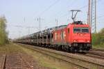 Die 185 587-3 der HGK auf ihrem Weg durch Lintorf am 10.04.2011

