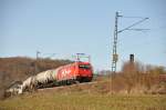 HGK 185 631-9 mit einem lzug bei Urspring, am 1.Mrz 2010.