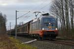 242.516 Ferdinand mit einem Gterzug Rchtung Norden am 8.1.12 bei Padenstedt